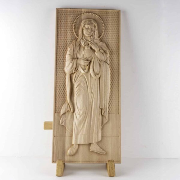 Reliéf z masivního dřeva, vyobrazující pannu marii